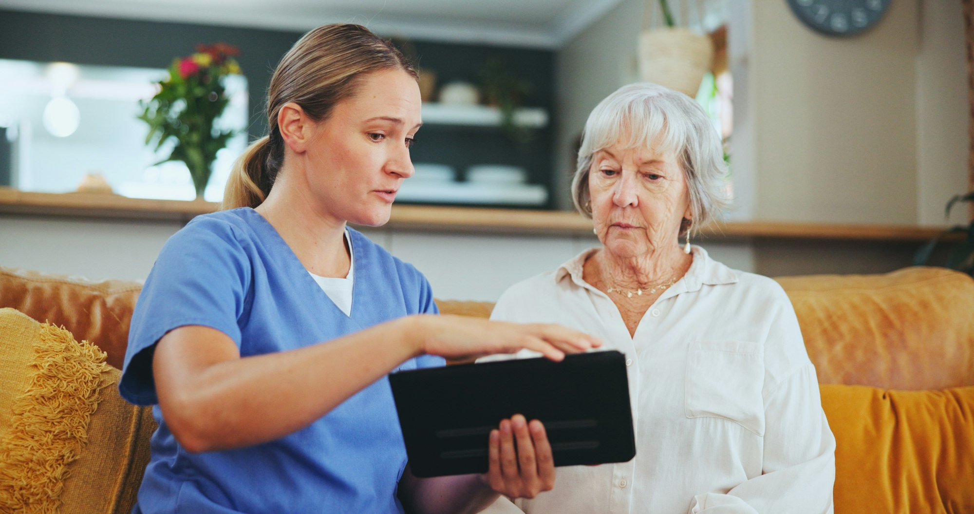 Senior woman, nurse and consulting with tablet for healthcare, medicare or results at nursing home.