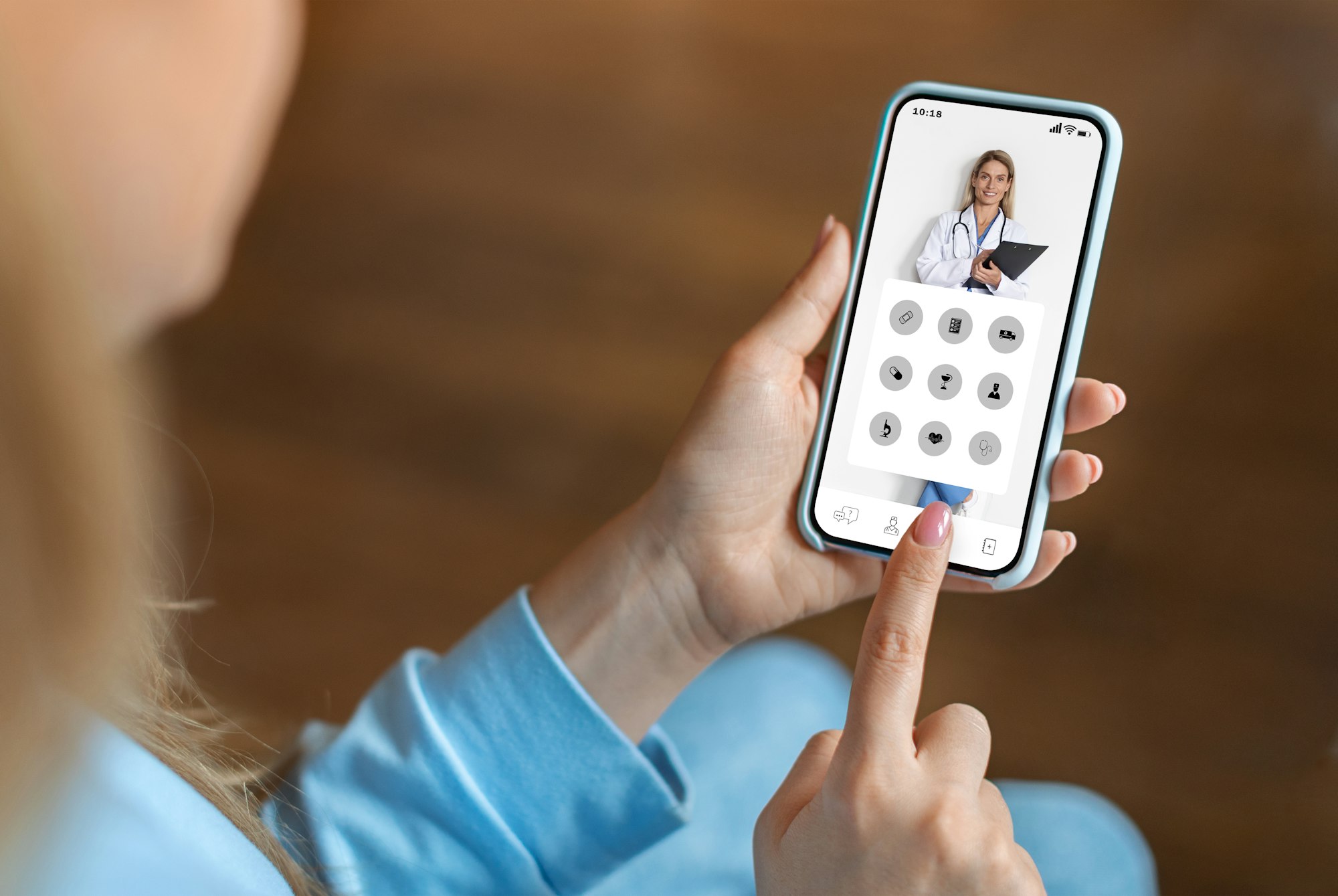 Young woman using medical app on smartphone at home